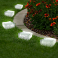 Set van 8 glazen zonnestraatstenen met 4 witte leds voor tuinverlichting