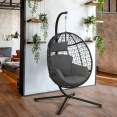 Grijze opengewerkte eivormige fauteuil met grijs kussen