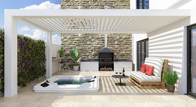 Une pergola blanche placée sur une terrasse ensoleillée